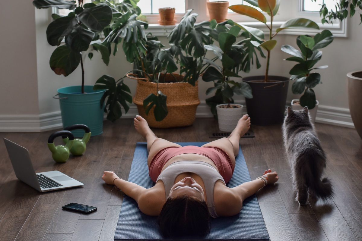 Young Girl Lying in Savasana Resting Pose at the End of Yoga Pra